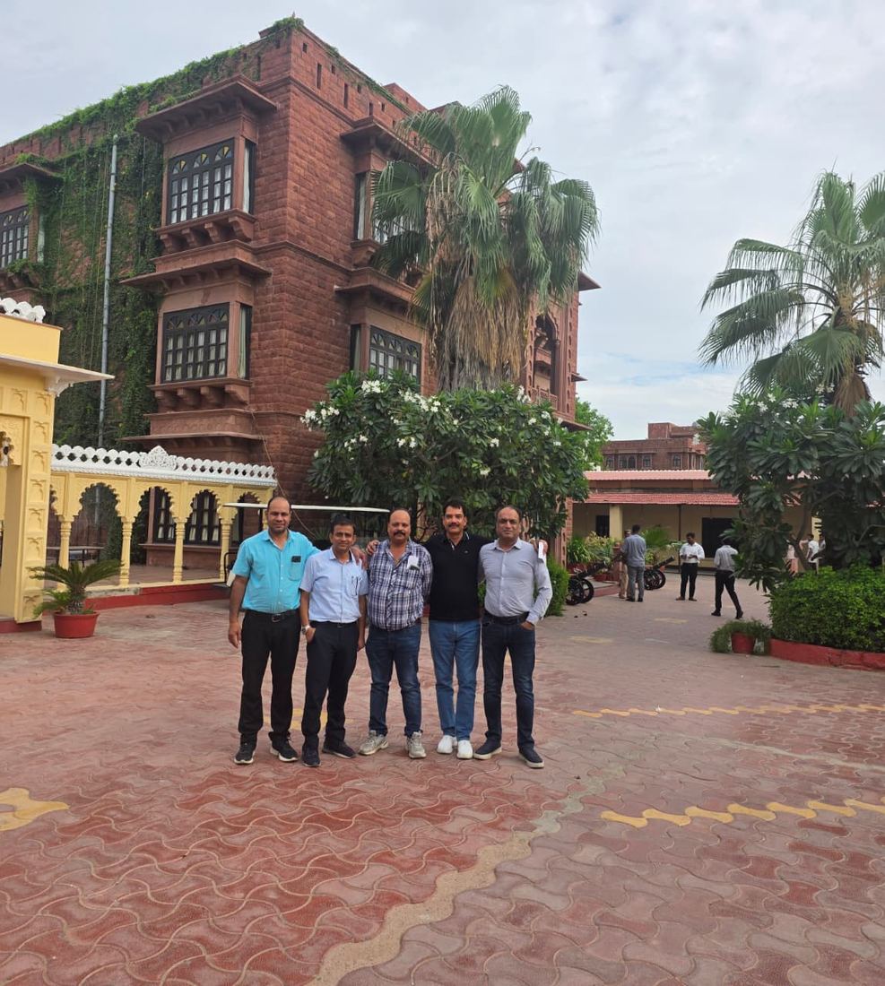 Garh Govind's red sandstone main building, with a few batchmates out front